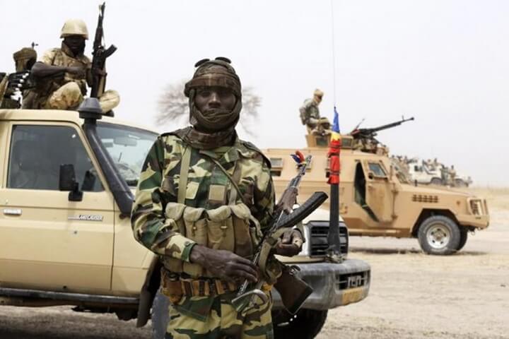 A Chadian soldier poses for a picture at the front line during battle against insurgent group Boko Haram in Gambaru, February 26, 2015.     REUTERS/Emmanuel Braun