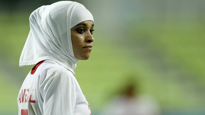 FILE- In this Sept. 18, 2014 file photo Jordan's Anfal Nayef Hammad Alsufy watches play during her team's football match against Japan at the 17th Asian Games in Incheon, South Korea. Qatar's delegation chief says the women's basketball team has withdrawn from the Asian Games after organizers refused to let players wear hijabs in competition. (AP Photo/Kin Cheung,File)