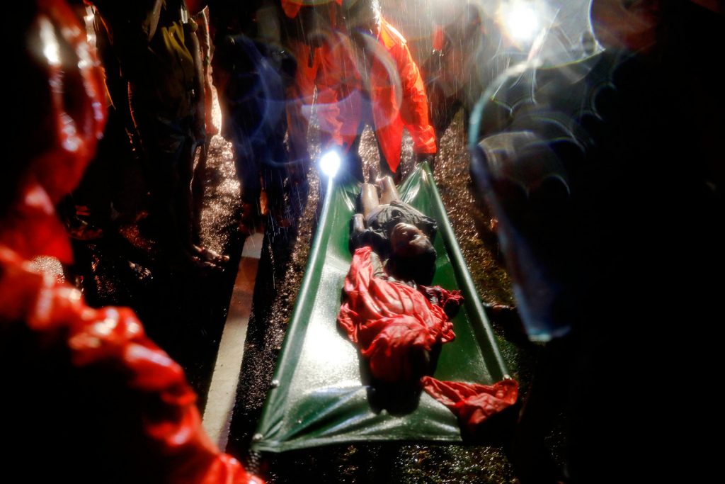 Bodies of Rohingya refugee children are transported after their boat with passengers fleeing from Myanmar capsized off the Inani beach near Cox's Bazar